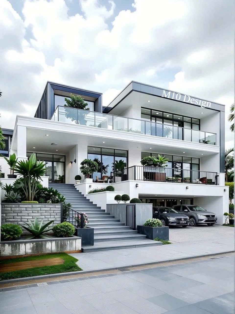 Biệt thự trắng nhiều tầng với lan can kính, bậc thang dẫn lên sân và cây xanh trước nhà.